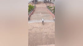 Bungling cyclist crashes into food stall after uncontrollably wheeling down ramp in Mexico