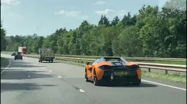 Reckless person throws bottle out a car window causing a £150k McLaren to dangerously swerve on UK motorway