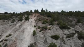 enduro bikes climbing a mountain of fine white sand, in @pascuetooffroadcenter