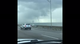 Waterspout spotted over Tampa Bay sky during a morning commute