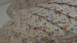 Buddhist temple decorated with thousands of losing lottery tickets as warning against gambling