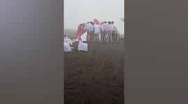 Defiant couple continue with wedding as TYPHOON batters them in the Philippines