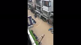 HIT AND RUN: Car driving through flooded streets knocks over several mopeds