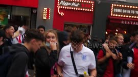 UK Met Police Chased out of Leicester Square by England football fans