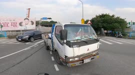 CLOSE CALL: Oops! Truck trying to rush traffic lights nearly hits bike, then gets rear-ended!