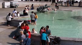 Londoners enjoy the heatwave while cooling off in the fountains of Trafalgar Square
