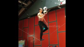 Spinning 3 Balls on a Finger While Balancing on a Slackwire