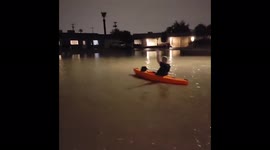 US: Arizona Resident Kayaks Down Flooded Street After Storm Hits Phoenix Metro