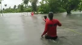 Kind volunteers save girl stranded with family during typhoon In-fa in the Philippines