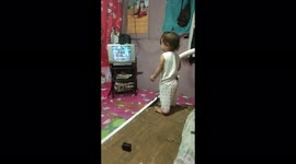 Baby crazy dancingwatching in his favorite game shows on tv