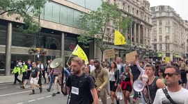 'Children and kids, don't take the vaccine!' rap anti-vaccination protesters in London