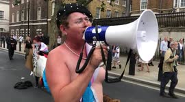 Topless trans woman, Sarah Jane Baker, marches ahead of Reclaim Pride March in London