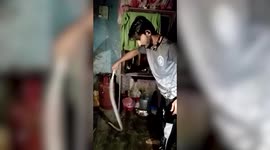 Giant snake spreading panic while slithering in kitchen gets rescued