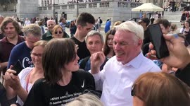 David Icke, a conspiracy theorist and former football player, takes selfies with fans at an anti-lockdown protest