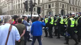 Scuffles at Parliament Square as police disperse anti-lockdown protesters who were partying in the road