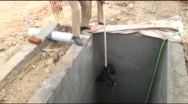 Rescuers in southern India haul dog to safety from bottom of water tank
