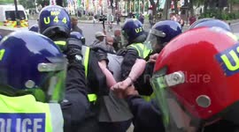 Police chase man out of Parliament Square during anti-lockdown protest