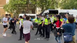 Anti-vaxxers scuffle with police outside Downing Street during a protest in London, UK