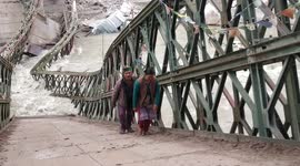 Villagers in northern India risk lives using bridge destroyed in landslide