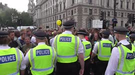world wide freedom rally riot police make arrests In this clip, protesters clash with the police outside parliament square during the 'World Wide Rally For Freedom'.