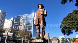 City hall agents clean the statue of the bandeirante Borba Gato in Sao Paulo, Brazil