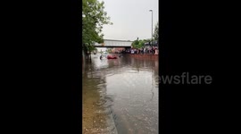 UK: Man Crosses Flooded Street In London, Mocks Rescue Of Motorists Stranded Inside Car