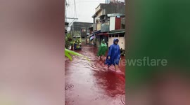 Blood-red floodwaters baffle residents during typhoon In-fa in the Philippines