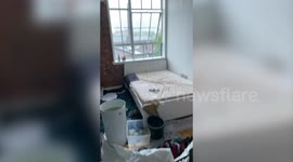 Torrential rain causes leak in ceiling and flooding in London flat