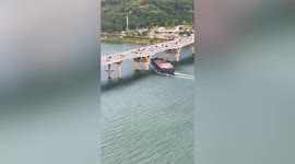Cargo ship crashes into bridge in southern China as cars drive over