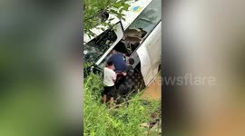Bus carrying more than 60 passengers flips over on Chinese highway killing 13