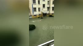 Chinese resident goes for a swim in floodwater brought by Typhoon In-fa