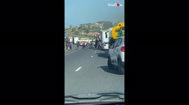 'Disturbing Footage of Looters Stealing from Cars During South Africa Riots'