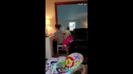 Twin babies do everything in their power to distract mum from work