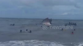 Terrified passengers struggle to get off ship due to rough waves before it sinks during typhoon In-fa in the Philippines