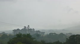 Lightning bolt, loud thunder and torrential rain storm in Scotland.