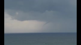 Waterspout spotted off the Welsh coast as huge summer storms strike the UK