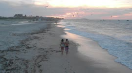 Drone Video - jericoacora - couple walking on the beach watching sunset