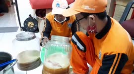 Indonesian men prepare some very slimy-looking kombucha