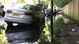 Flooded London Street with car submerged in water
