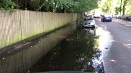 Flash floods in London car submerged in water