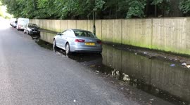 Flooding in England  video to show cars trapped in floods in England in London as they suffer weather destruction