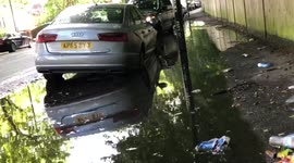 Parked vehicles left submerged after heavy squalls hit London
