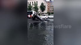 Car falls into sinkhole that opens up on Chinese road