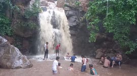 Tourists escape as rainfall sees waterfall suddenly cascade with increased force in India