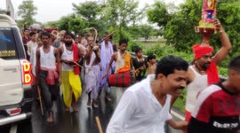 The People's keep swinging with snakes around their necks and in their hands on the day of Nagpanchami