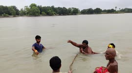 The Priest has catching snakes on the day of Nagpanchami at Sindhiya Ghat