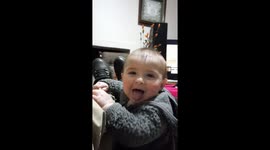 Adorable footage of baby who mimics his father making growling noises and singing