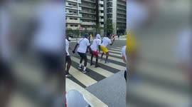 The Ghanaian Olympics track and field team dancing on the streets of Tokyo will give you that Friday feeling