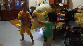 Funny Kids Learn How to Learn Kick Boxing Together with Her Brother at Home