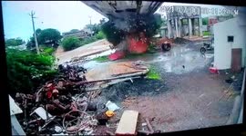 Water tank in western India suddenly collapses leaving surrounding area swamped